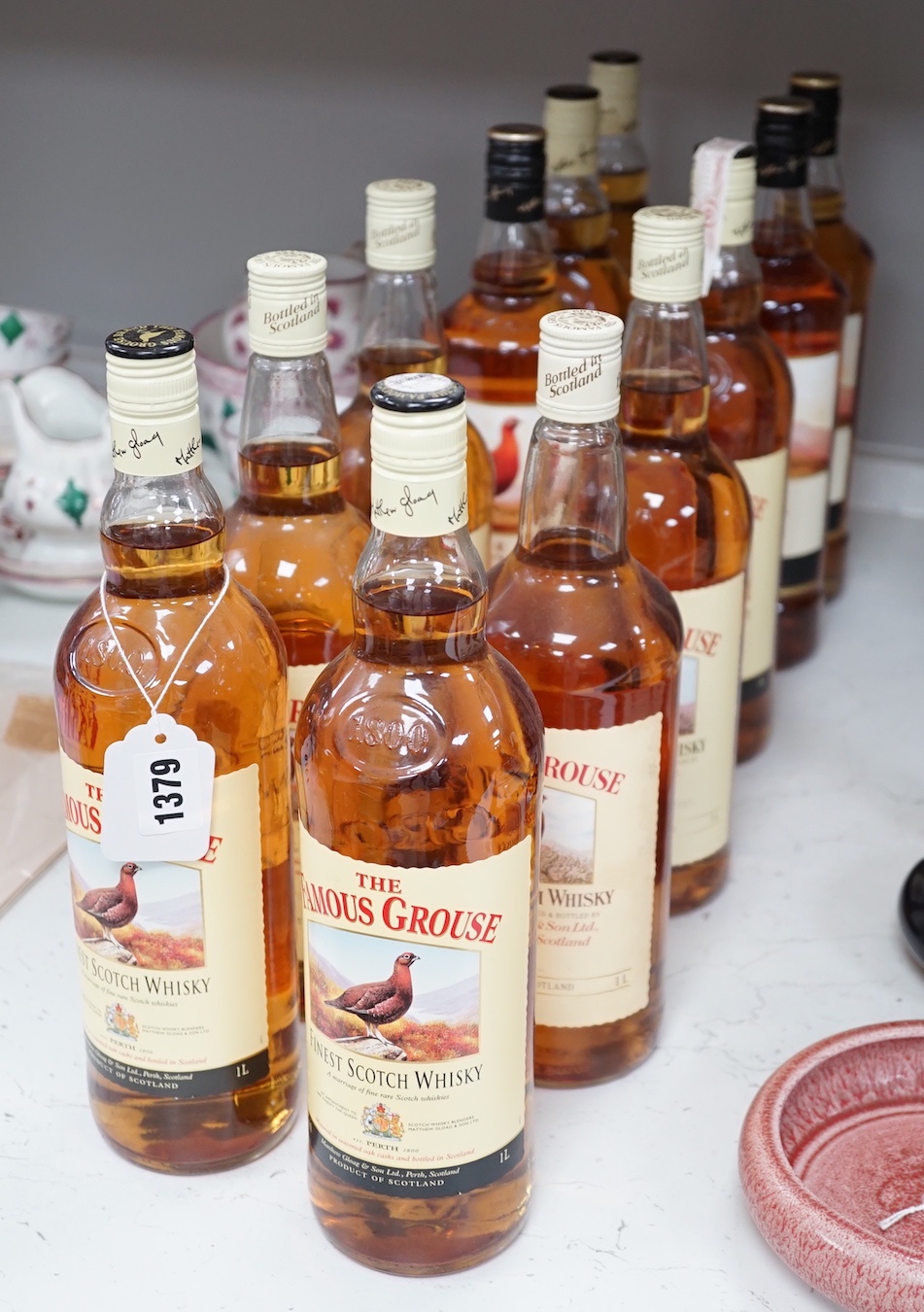 12 single 1 litre bottles of The Famous Grouse scotch whisky